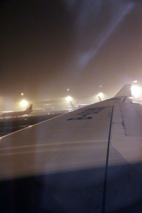Mist rising from the taxiway following heavy rain at Beijing.