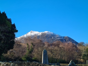 The snow capped mountain, Suidhe Fhearghas, from Sannox Cemetery on the Isle of Arran.