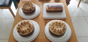 Three round and one rectangular simnel cakes